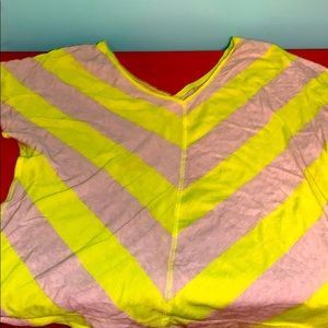 A yellow and white off shoulder shirt